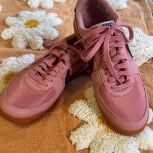 Nike Women’s Pink Sneakers with Black Swoosh and Gum Sole